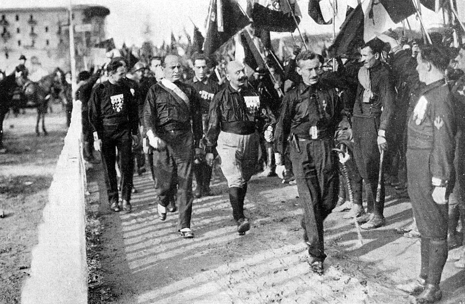 Fascist Blackshirts marching during the March on Rome, October 1922, with Mussolini among supporters